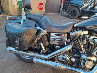 This is a Harley Davidson Dyna wide glide motorcycle with 59889 kilometers on it, showcasing a sleek...