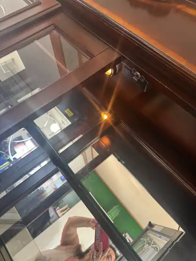 Dining room table and hutch, table has 8 chairs and a leaf( has water damage), hutch has 3 way light...