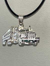 Necklace with truck pendant.