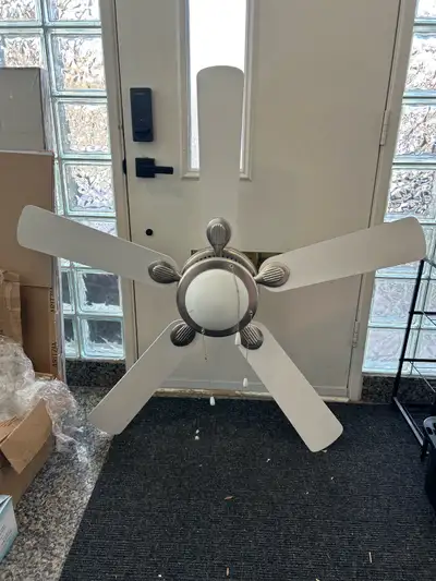 I'm selling a used ceiling fan, perfect for cooling down any room. It's in good working condition, r...
