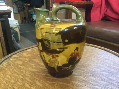 One of the extremely rare Kingsware Royal Doulton whisky flasks in Arts & Crafts style called “A Sai...