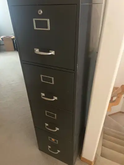 Organize your documents efficiently with this sturdy four-drawer metal file cabinet, perfect for kee...
