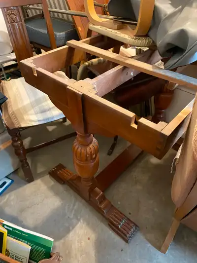 WALNUT WOOD AND WALNUT COLOR SOLID WOOD 80 YEARS OLD AROUND 4 CHAIRS TABLE HAS 2 LEAFS IN IT WHICH E...