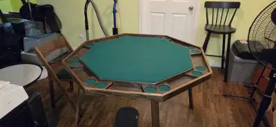 Wooden poker table with green felt. Comes with 4 chairs