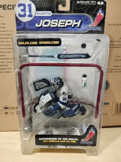 This is a McFarlane Toys Curtis Joseph Goaltender NHLPA figure. This item is used, but still in grea...