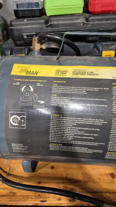 This is a used Allman portable 7-gallon air tank, perfect for various inflation and pneumatic tool a...