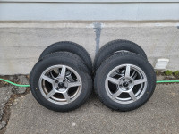 Like New 4x100 Rims and 195/65R15 All Season Tires set of Four