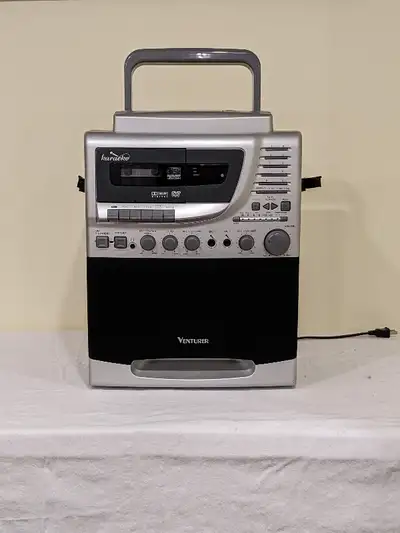 Karaoke machine w/travel case and mic; used, good condition, View more