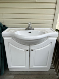 Sink with cabinet and facet 