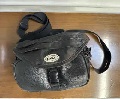 Original Canon camera bag, black leather, multiple compartments., View more