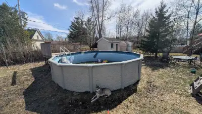 This is a used round above-ground pool with a sturdy frame, perfect for summer fun. It shows signs o...