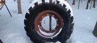 2 75A Michigan loader rims with old tires $150each