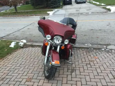 This is a used Harley-Davidson motorcycle, perfect for cruising down the open road, featuring a comf...