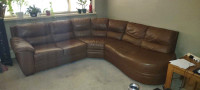 Leather couch, Spector table 3 chairs.