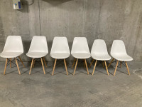 Set of White chairs with wood legs 