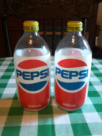 2 vtg 1990 PEPSI 500 ml limited edition bottles with win caps.