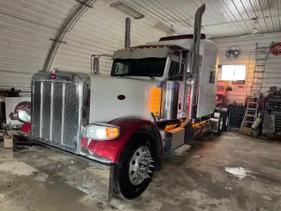 I'm selling a striking 2018 Peterbilt 389, a highway tractor that commands attention with its bold r...