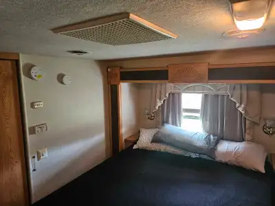 This big 40' motorhome has a large living room pullout and master bedroom pullouts on electric slide...