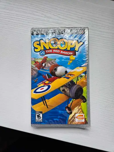 Brand New other then the top plastic Brand: Namco Hometek Inc Snoopy Vs. The Red Baron - PSP