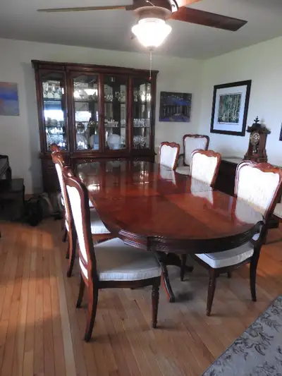Dinning set. Solid wood. Cherry and walnut with brass hardware and bevelled glass. Armoire has light...