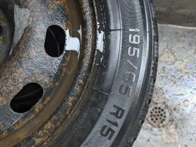 Set of four used winter tires on rims for Toyota Corolla
