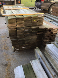 Reclaimed pressure treated fence boards