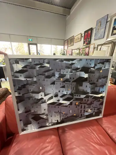 Elevate your decor with this captivating framed cityscape print, showcasing an abstract arrangement...
