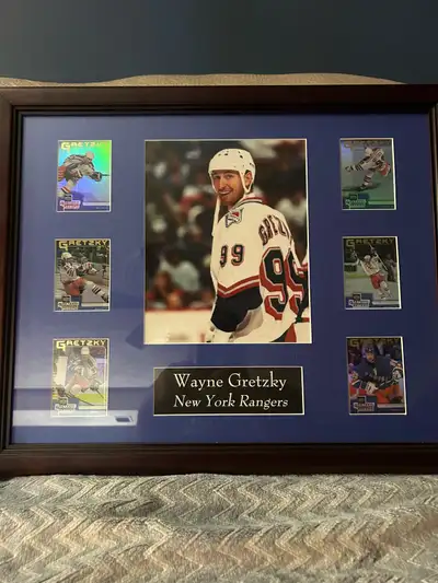 I am selling a framed display featuring Wayne Gretzky New York Rangers cards and a photo. The item i...