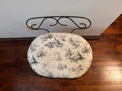 $80 or best offer - Elegant wrought-iron accent chair featuring decorative scrollwork and a toile-pa...