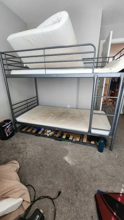 Ikea bunk bed metal frame twin size with pullout in good condition. Kids grown up and change their b...