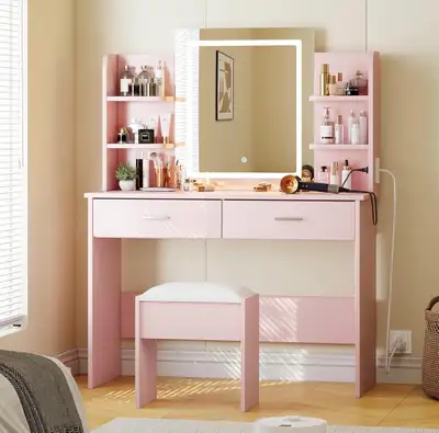 This barely used vanity desk offers a stylish and functional space-saving solution for your beauty r...