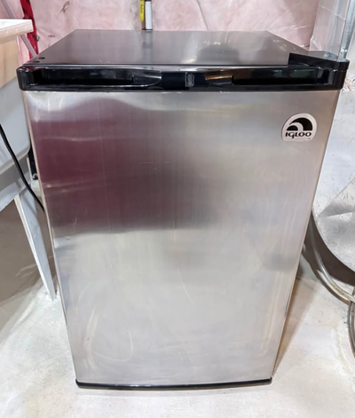 Compact mini fridge with freezer section—ideal for a bedroom, office, dorm, or basement. Works great...