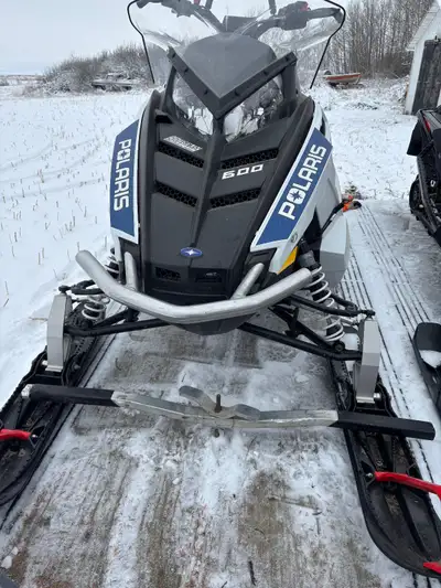 2015 Polaris 600 Voyaguer 144 x 2” track, front bumper, rear rack and bag, hitch, H and T warmers, e...