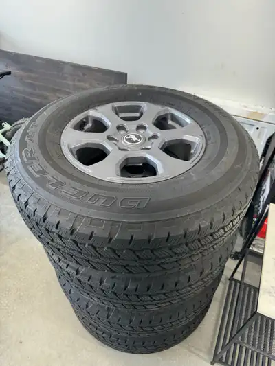 Brand new 2025 ford bronco 5 rims and tires Used to drive off the lot essentially the tires are Brid...