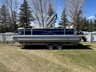 2013 Manitou Oasis 23 HSR pontoon boat. Evinrude E-Tex 150 HP motor. Engine has 216 hours. Boarding...