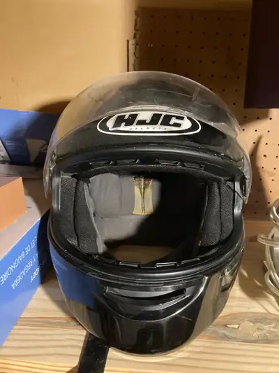 This is a HJC motorcycle helmet, size large, offering essential protection for any rider. This used...