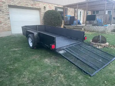 Solid steel utility trailer with ramp, new wood floor, new tires, freshly painted and working lights...