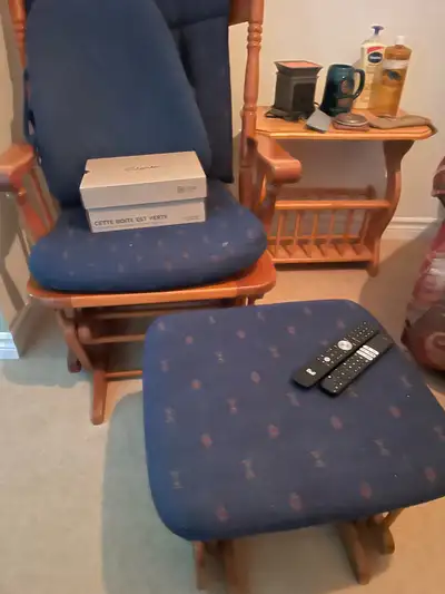 This is a rocking chair with a matching ottoman in gently used condition, a perfect addition to any...