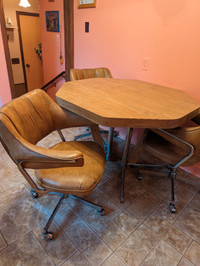Table and 4 swivel chairs, and extension leaf
