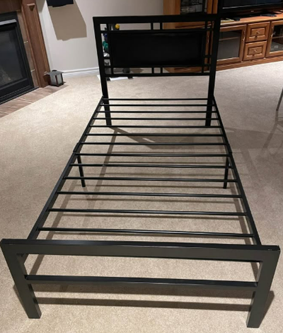 Metal bed frame. Measurements: 79" (L); 39.5" (W)