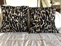 2 decorative leopard print throw pillows