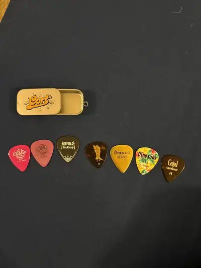 Guitar picks and container, View more