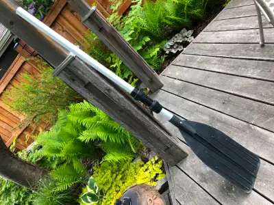 Aluminum shaft and poly-whatever blade. Comes apart into two sections: blade and shaft. I listed as...