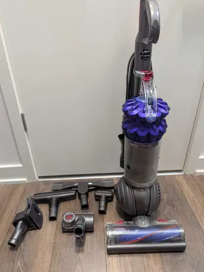 I'm selling a used Dyson DC51 Animal upright vacuum, perfect for homes with pets, featuring powerful...