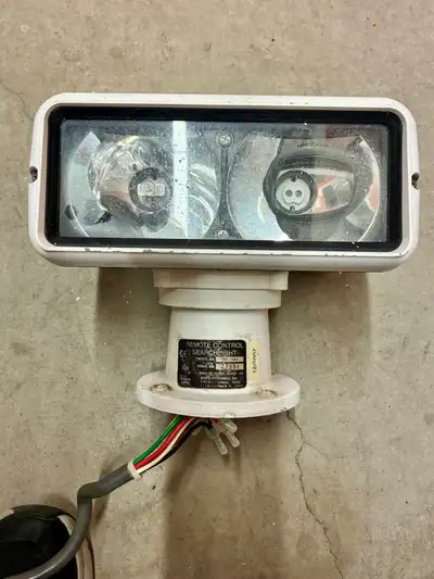 Marine spotlight with remote for boats. This is a $2500 system new. This one needs a bit of work. On...