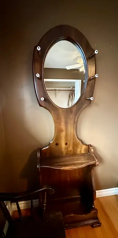 Attractive dark brown pine entryway mirror measures 23” wide X 73” high. Open to offers.