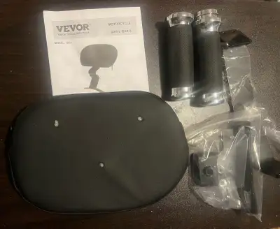 I'm selling a Vevor motorcycle sissy bar with a pad, accompanied by motorcycle grips and mounting ha...