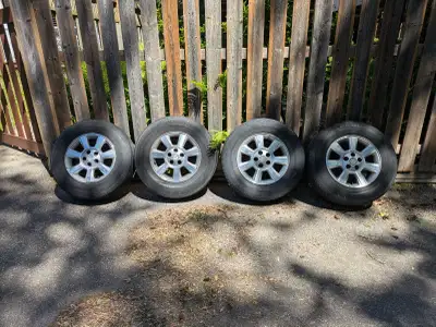 Pre-owned tires mounted on alloy rims, featuring a P235/70R16 tire size. 5 x 114.3mm bolt pattern Th...
