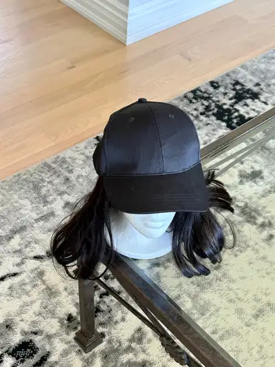 Wig attached to baseball cap, View more