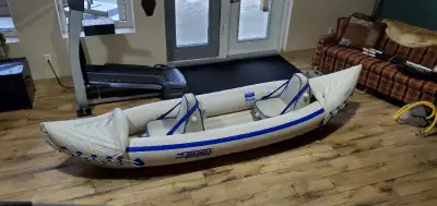 Sea Eagle 330 2 man inflatable kayak for sale. Comes with 2 inflatable seats and 2 paddles, foot pum...